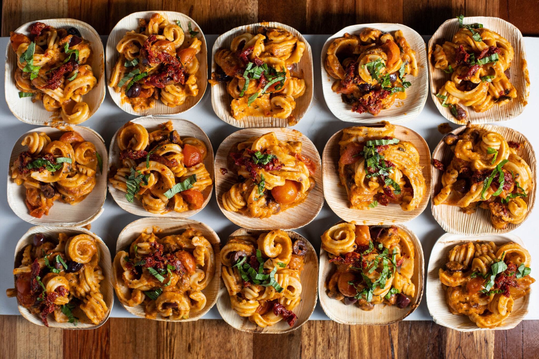 Mediterranean vegan sourdough pasta with olives, tomatoes, and fresh herbs
